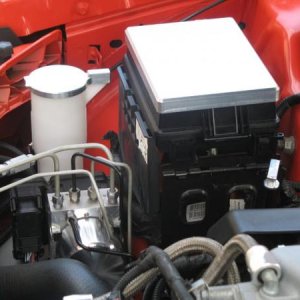 Billet fuse box cover and ABS motor cover.